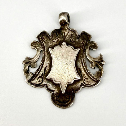 Antique Solid Silver Fob Medal – Birmingham 1895 – CES – Ornate Shield Design